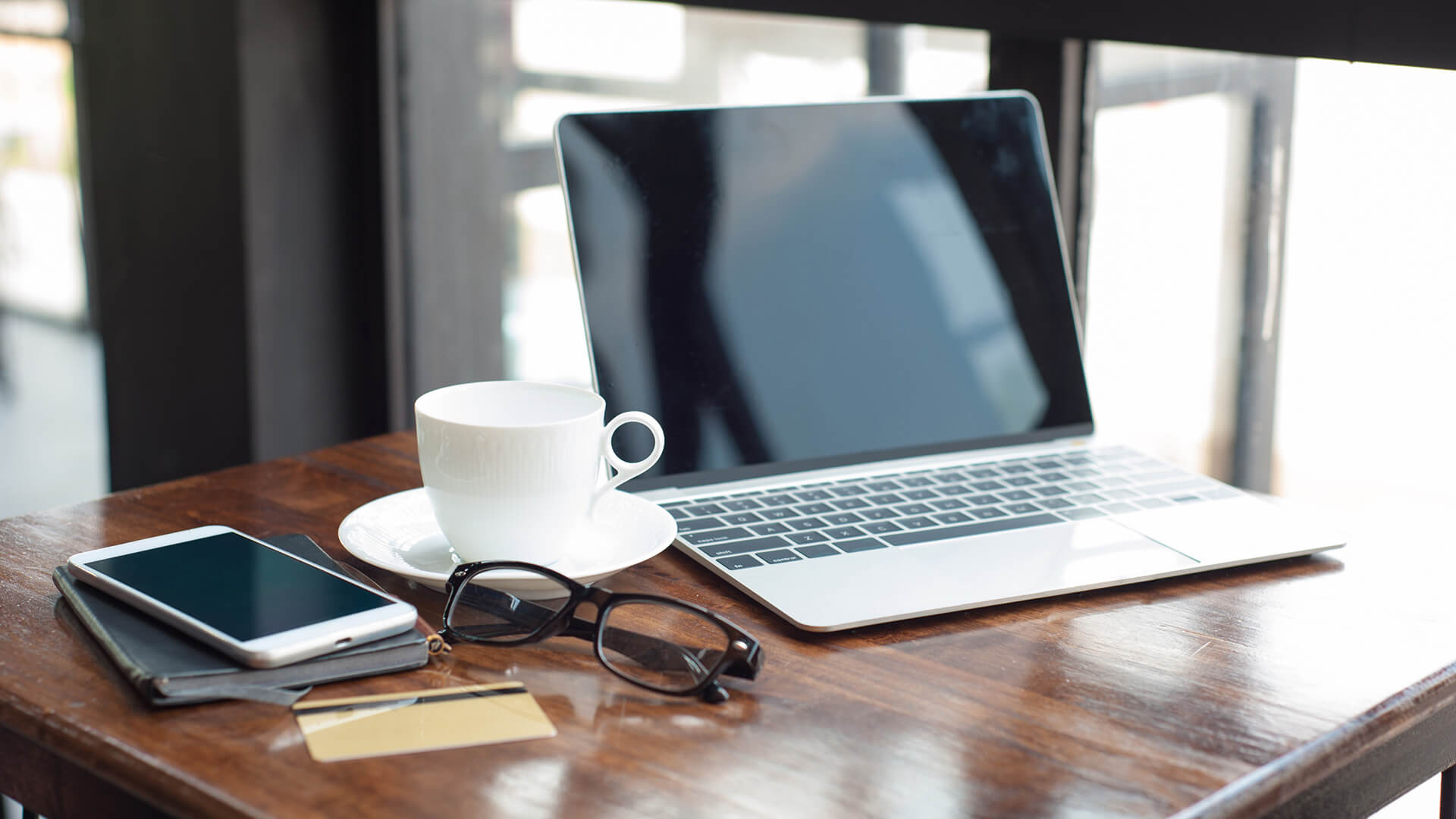 Working Desk With Laptop And Coffee Cup Early In The Morning